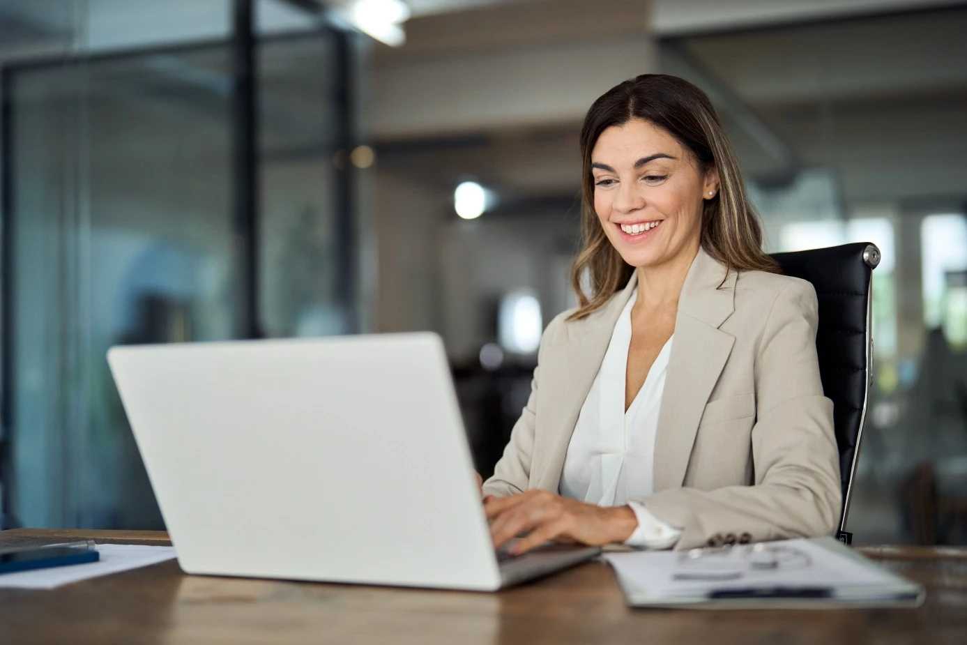Happy business woman using website to get website benefits